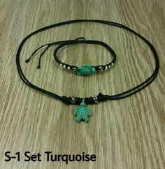 "Turquoise Turtle Necklace Adjustable Unisex Necklace Handmade Necklace with Turquoise Turtle Bead, Black Wooden Beads and Black Cord Adjustable Cord - Fits Most Size Styles N-1, N-2 and S-1 the necklace is adjustable with sliding knots from 16\" Inches up to 32 Inches Around the neck. The bracelet from 6\" inches up to 10\" inches The Styles A-1 Necklace, A-2 Necklace and A-3 Necklace are fully adjustable from 14\" Inches up to 22\" Inches around the neck. This are handmade with Wooden beads an Adjustable Turquoise Jewelry Gift, Adjustable Spiritual Turquoise Necklace For Beach, Adjustable Spiritual Turquoise Necklace For Meditation, Adjustable Turquoise Necklaces For Healing, Adjustable Turquoise Healing Necklace, Spiritual Adjustable Turquoise Necklace Gift, Adjustable Beaded Turquoise Necklace For Meditation, Spiritual Turquoise Beaded Adjustable Necklace, Adjustable Green Turquoise Necklace For Beach