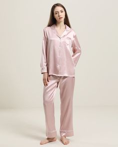 100% Mulberry Silk Breathable & Lightweight Lightweight & Comfortable Type: Two-piece Silk Pajama Set.Material: 100% 22 Momme Charmeuse Silk. Features: Satin, wear-resistant and stylish.Details: Cropped trouser length with self-tie at the waist, one left chest pocket with contrasting piping, and satin piping material. Experience the ultimate indulgence with these luxurious two-piece silk pajamas. Crafted from the finest 22 momme Mulberry silk, they drape beautifully on the skin with a glossy, sm Silk Pink Pj, Blush Silk Pajamas, Silk Pajamas Pink, Pink Silk Pyjamas, Pink Silk Long Sleeve Sleepwear, Silk Socks, How To Wash Silk, Light Blue Roses, Pink Peacock