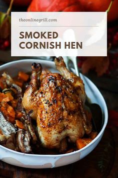 a white bowl filled with cooked chicken and carrots on top of a wooden table