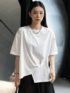 Sku CY-!87035 Material >90%Cotton Style Short Sleeves Feature Asymmetric , Split-joint Neckline Round-neck Occasion Casual , Urban , Simple Seasons Summer Type T-Shirts Tops Color WHITE Size FREE SIZE Please consult the size chart we provide for this item's measurements to help you decide which size to buy.Please note: There may be 1-3cm differ due to manual measurement.CMINCH Bust Shoulder Sleeve Length FREE SIZE 124 57 21 70 Model's information : Weight : 46 KgHeight : 168 Cm (66.14 Inches)Siz Casual Irregular Summer Tops, Casual Summer Tops With Irregular Shape, White Asymmetrical Cotton Top, Asymmetrical Casual Summer T-shirt, Casual Asymmetrical Summer T-shirt, Casual Solid T-shirt With Asymmetrical Hem, Casual Asymmetrical T-shirt For Summer, Casual White Asymmetrical Tops, White Casual Top With Asymmetrical Hem