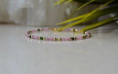 "This delicate gemstone bracelet is made of high quality gemstones - Pink Tourmaline, Watermelon Tourmaline (green beads) and Gold Hematite. This bracelet is ultra-delicate and dainty, it would be a great gift for beautiful yourself or for a person who needs to feel it. Pink Tourmaline gives a person inner light, which attracts benevolent people and joyful events. The stone also helps its owner to fight unreasonable fears and self-doubt. . ❗️Sign up to our Newsletter and get 15% OFF your order ( Pink Crystal Bracelet, Sunstone Jewelry, Green Watermelon, Amazonite Bracelet, Tourmaline Bracelet, Garnet Bracelet, Women Bracelet, Inner Light, Pretty Bracelets