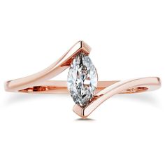 a rose gold engagement ring with a pear shaped diamond in the center and two curved bands