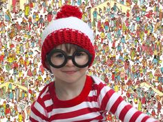 a young boy wearing glasses and a knitted hat