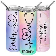 three different colored cans with straws in them