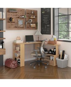 a computer desk sitting on top of a hard wood floor next to a wall mounted chalkboard