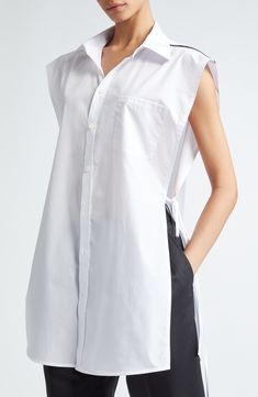 Split sides bridged by slender ties offer a sense of airy ease to this sleeveless cotton shirt designed in an oversized silhouette. Asymmetric contrast trim completes this contemporary look. 34" length (size Medium) Front button closure Spread collar Sleeveless Chest patch pocket Side slits 100% cotton Dry clean Made in the USA Designer Clothing Asian & Pacific Islander Owned/Founded Boxy Button Up Shirt, Peter Do, Pacific Islander, Cropped Crewneck, Cut Up, Mm6 Maison Margiela, Oversized Silhouette, Poplin Shirt, Sleeveless Shirt