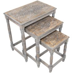 a set of three wooden tables with carved designs