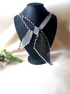 "Necklace-scarf \"Business Lady\". Classic black and white colors. Beaded tie tied bow. Beaded jewelry A gift for her Black necklace Delicate handmade jewelry Necklace made of Czech beads. Necklace circle 55 cm or 21,65 inches. If you need another color or length, email me. If you have any questions, email me. Thank you for your interest in my work." Elegant Black Necklace With Bow, Black Ribbon Necklace For Party, Adjustable Black Ribbon Necklace, Black Bow Jewelry For Gifts, Black Bow Jewelry Gift, Black Bow Jewelry For Gift, Black Bow Tie Jewelry For Party, Black Necklace With Ribbon For Gift, White Bow Tie Jewelry As Gift