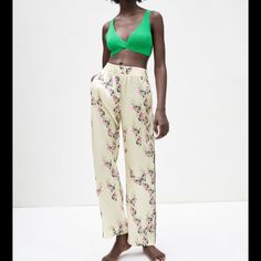 Piped Printed Pants. High Waisted And Flowy With Elastic Waistband. Front Pockets With Contrasting Detail Chic Viscose Pants For Vacation, Chic Green Bottoms For Loungewear, Viscose Summer Pants For Daywear, Summer Loungewear Viscose Pants, Summer Daywear Viscose Pants, Summer Viscose Daywear Pants, Spring Vacation Tapered Leg Bottoms, Summer Viscose Bottoms With Tapered Leg, High Waist Viscose Pants For Spring