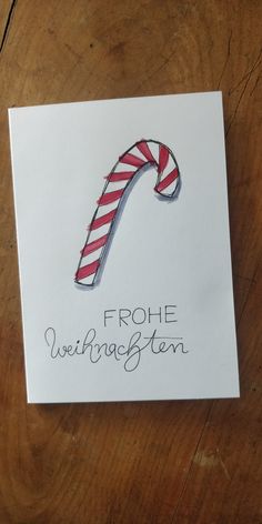 a christmas card with a candy cane on it that says, frohe weiingsten