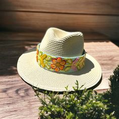 Our Fedora Straw Hat, comes with a removable hand embroidered band. The band is embroidered by Female Artisans of the Andes in Perú. This classic Fedora style Hat can be used in the beach and all adventures in the sun. Perfect for travelling. Three options for bands available: Spring Flowers, Mint and Rust Flowers, Browns One size Handmade Adjustable Panama Hat For Spring, Traditional Woven Straw Hat For Spring, Summer Brimmed Hats With Embroidery, Embroidered Summer Hat With Short Brim, Summer Embroidered Short Brim Hat, Adjustable Festival Cap Sun Hat, Adjustable Festival Sun Cap, Embroidered Brimmed Sun Hat For Summer, Festival Woven Fedora With Flat Brim