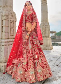 Traditional Bridal Red Silk embroidered lehenga choli AA151Desc: Style : Circular Lehenga Color : Red Fabric : Silk  Work :Haevy Embroidery Wash Care : Dry clean Sleeve Style : Half Sleeve Long Sleeves : Done only in Custom Stitch Sleeves Lining : Done only in Custom Stitch Bust Size : 32 to 42 Inches Occasion : Wedding Mehendi Engagement Reception Ceremonial Baby Shower Party Wear:Semi stitch lehenga choli.Size till 42 inch.heavy bridal lehenga choli Pink lehenga choli silk...