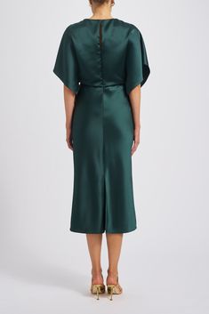 Fluid satin dolman sleeve bias midi dress. Shown in Petrol. Green Silk Satin Dress For Formal Occasions, Satin V-neck Midi Dress With Draped Sleeves, Green Satin Silk Midi Dress, Green Silk Dress For Evening With Bias Cut, Green Midi Dress With Draped Sleeves, Green Silk Midi Dress For Formal Occasions, Silk Maxi Dress With Draped Sleeves For Dinner, Green Satin Knee-length Evening Dress, Bias Cut Satin Knee-length Dress