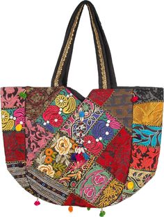 a multicolored patchwork tote bag with tassels and pompoms