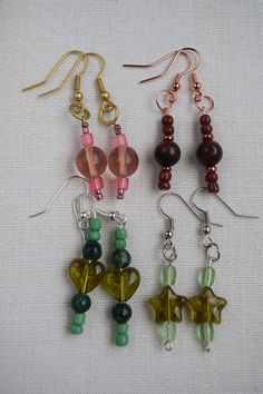 I make all of my beaded earrings by hand. They are fun and unique and will have everyone asking where you found them. They make a wonderful gift for a Birthday, holiday or just to make someone feel special. Please check out my SHOP for additional listings of beaded jewelry, magnets, brooches, blankets AND MORE (https://www.etsy.com/shop/CreationsByBronte) Handmade Cheap Beaded Drop Earrings, Cheap Small Handmade Earrings, Vintage Bead Earrings, Handmade Beaded Jewelry Earrings, Handmade Drop Earrings For Birthday, Handmade Green Earrings For Birthday, Handmade Dangle Jewelry For Birthday, Handmade Green Earrings For Birthdays, Handmade Dangle Earrings For Birthday