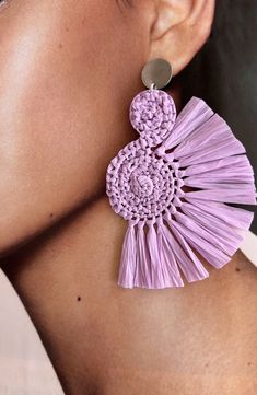 These Handcrafted Lavender Raffia Earrings are the perfect addition to any boho-inspired outfit. Made with love and attention to detail, each earring features a unique spiral shape, giving a touch of elegance and playfulness. The vibrant purple color will effortlessly complement any skin tone, making them perfect for any occasion. The fringes add a trendy and stylish touch, adding movement and texture to your look. With their unique design and boho style, these earrings are a must-have accessory Purple Handwoven Earrings As A Gift, Handmade Adjustable Lavender Earrings, Purple Bohemian Earrings For Beach, Purple Earrings For Summer Beach, Handwoven Pink Jewelry For Summer, Summer Handwoven Pink Jewelry, Purple Dangle Earrings For Beach, Purple Bohemian Jewelry For Summer, Purple Dangle Earrings For The Beach