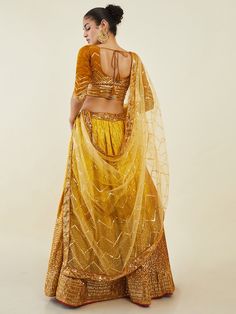 Introducing the captivating yellow sequins art silk haldi wear lehenga choli, a stunning ensemble that exudes elegance and charm. Crafted with precision and adorned with intricate details, this lehenga choli is perfect for special occasions such as receptions, weddings, festivals, and functions like haldi.
Made from high-quality yellow-color art silk material, this lehenga features exquisite sequin work and zari embroidery on a shaded fabric, adding a touch of glamour and sophistication. The mat Yellow Choli With Sheer Dupatta For Eid, Navratri Art Silk Sequined Lehenga, Navratri Art Silk Lehenga With Sequins, Bollywood Style Yellow Kundan Set, Yellow Kundan Bollywood Set, Bollywood Kundan Yellow Set, Gold Lehenga With Mirror Work In Art Silk, Gold Art Silk Lehenga With Mirror Work, Yellow Anarkali Choli With Sheer Dupatta