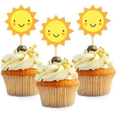 three cupcakes with white frosting and sun decorations