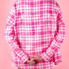 Introducing our newest cult classic flannel being added to the Cakworthy roster, the Cardcaptor Sakura Flannel. This unisex, pink plaid flannel includes key elements from the 1998 anime that fans will love. The back of the flannel showcases the intricate details of Magic Circle, including the sun and crescent moon. Sakura’s signature winged hair accessories were embroidered onto the collar while duo pocket designs were added to the front, one of Sakura’s Sealing Staff and the other of Kero-chan. Kero Chan, Pocket Designs, Magic Circle, Cardcaptor Sakura, S Signature, Pink Plaid, Plaid Flannel, Intricate Details, Crescent Moon