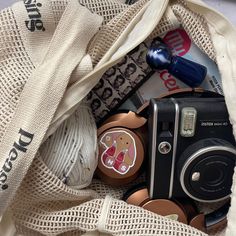 a camera and some other items in a bag