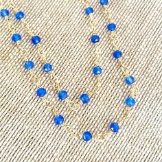 Tiny beads necklace rosary style with either blue chalcedony or sapphire. Length Blue Chalcedony 18" Length Sapphire 19" Blue Sapphire crystals have an excellent energy within the throat chakra to aid your communication ability. Blue chalcedony energies mainly focus on your throat and enables you to speak freely. -This information is intended for spiritual support only Chalcedony beads 3mm Sapphire 3-3.5mm Wire & Findings 14K GF Blue Beaded Chalcedony Necklace, Blue Chalcedony Bead Necklaces, Blue Chalcedony Gemstone Bead Necklaces, Blue Chalcedony Round Beads Necklace, Blue Beaded Chain Spiritual Necklace, Blue Beaded Chain Necklace With Spiritual Style, Blue Spiritual Beaded Chain Necklace, Blue Crystal Necklaces With Faceted Beads For Gifts, Blue Double Strand Gemstone Beaded Necklaces