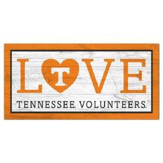 an orange and white sign that says love tennessee volunteers