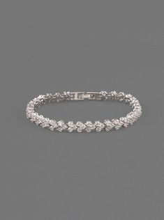 This enchanting white gold crystal tennis bracelet features hand-set Cubic Zirconia crystals. This medium weight bracelet can be worn alone or stacked for the ultimate glamour look Materials - Available in: 18K White Gold over Brass - Cubic Zirconia pave crystals - Hypoallergenic, lead, and nickel free Details - Available in 2 sizes: 6.5in (16.5cm) or 7in (17.8cm) - Width: 0.25in (6mm) - Fold over clasp ► SHOP SILVER BRIDAL BRACELET COLLECTION https://www.etsy.com/shop/AMYOBridal?section_id=2296 Classic Cubic Zirconia Crystal Bracelet For Wedding, Wedding Crystal Bracelet In Diamond White With Brilliant Cut, Diamond White Brilliant Cut Crystal Bracelet For Wedding, Classic Diamond Crystal Bracelet For Wedding, White Gold Crystal Bracelets With Sparkling Stones, Elegant Wedding Crystal Bracelet With Brilliant Cut, Silver Tennis Bracelet For Wedding, Classic Crystal Bracelets For Wedding, White Sparkling Diamond Bracelet For Wedding