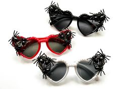 ✨Gorgeous unique eye wear by Alexis Exclusive.. ✨These unusual glasses are the perfect accessory for adding that special touch to your Halloween, fancy dress, special events or everyday wear. ✨The frames are heart black plastic and they have tinted dark lenses. On either end they have a few creepy spiders plus black pearls around the top of the frames. ✨Great for festivals, holidays, special occasions or everyday wear.. .  ✨UV protection. ✨Exclusive design made by myself, you won't see any others like these anywhere else. ✨All my glasses come in a black pouch to keep them safe, please also handle with care. ✨Checkout the full collection of Sunnies here :  https://www.etsy.com/uk/shop/AlexisExclusive?ref=s2-header-shopname ✨To be kept up to date with new designs please  FAVORITE MY SHOP. (C Plastic Halloween Costume Accessories, Plastic Costume Accessories For Halloween, Black Plastic Costume Accessories For Cosplay, Novelty Plastic Costume Accessories For Party, Fun Plastic Costume Accessories For Costume Party, Novelty Party Costume Accessories Made Of Plastic, Black Plastic Halloween Costume Accessories, Fun Plastic Costume Accessories For Party, Novelty Black Plastic Costume Accessories