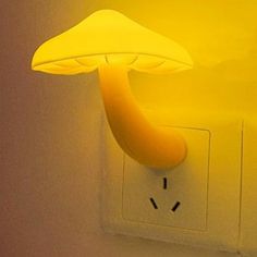 a yellow mushroom light is on the wall