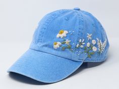 Flower is 100% hand embroidered on a 100% cotton wash baseball cap. Hat is one size fits all with adjustable back strap. Unique cap, one of a kind! I am also open for customization. If you want the item in different colors, please message me, it will take additional 2-3 days of handling time. Free first class shipping, upgradable priority mail service. 30 days return policy, feel confident at your purchase! Cheap Embroidered Cap, Affordable Embroidered Baseball Cap, Spring Blue Baseball Cap With Embroidered Logo, Blue Hats With Embroidered Logo For Spring, Blue Visor Baseball Cap For Spring, Blue Spring Hats With Embroidered Logo, Spring Blue Hats With Embroidered Logo, Spring Snapback Hat With Custom Embroidery, Adjustable Hat With Custom Embroidery For Spring