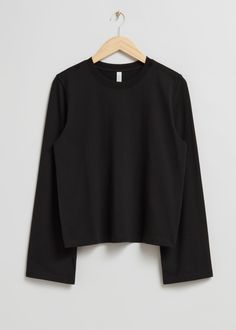 Long-sleeve top featuring a round-cut neckline and a relaxed, regular-length silhouette.Length of top: 56cm /22" (EU 36 / UK 8 / US 4) Black Long Sleeve Top, Fashion Wishlist, Linen Skirt, Short Jumpsuit, Fashion Story, Jersey Top, Swimwear Fashion, Trouser Jeans, Scarf Hairstyles