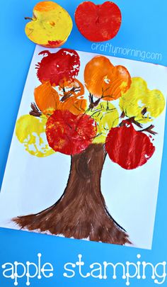 an apple tree made out of paper on a blue background with the words apple stamping