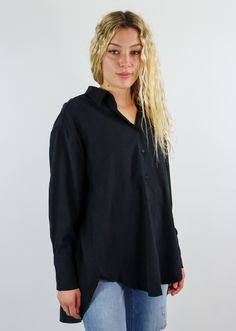 This oversized black button down is a closet essential! It features an oversized fit with button down closures in the front. There are so many ways you can style this staple piece! Pair this top with a pair of jeans and wear it half tucked in for a casual but put together look or throw a sweater over it a pull the collar through for more of a business casual look. Model Info Meet Zoe! Here she is wearing a size small. Hips: 35” | Waist: 25” | Bust: 32” | Height: 5’7” The Details Button Down Fron Effortless Long Sleeve Black Tops, Oversized Black Tops With Buttons, Oversized Black Top With Buttons, Oversized Tops With Snap Buttons For Everyday, Versatile Black Button-up Shirt, Versatile Black Fall Shirt, Oversized Button-up Blouse For Everyday, Everyday Versatile Oversized Shirt, Versatile Everyday Fall Shirt