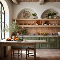 a kitchen filled with lots of counter top space next to a wooden dining room table