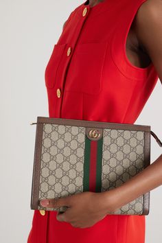 A part of Gucci's iconic 'Ophidia' range, this pouch is made with the brand's signature 'GG Supreme' printed canvas and sports contrasting green and red stripes. Crafted in Italy, it's outlined by textured-leather trims, features interlocking gold-tone 'GG' hardware and unzips to reveal a single suede-lined compartment.  Wear it with: [Gucci Dress id1202947], [Prada Boots id1258203]. Ladies Purses Handbags, Gucci Gg Bag, Gucci Pouch, Gucci Clutch, Gucci Dress, Gucci Ophidia, Handbags Luxury, Gucci Tote, Colorful Bags