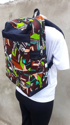 Ankara backpack with denim hence very strong. It has comfortable back handles It has a finger handle or hanging tag It has cotton linning with a laptop padded space.  Has adjustable handles Casual Rectangular Backpack With Laptop Sleeve, Casual Backpack With Laptop Sleeve For Daily Use, Casual Laptop Sleeve Backpack, Casual Backpack With Laptop Sleeve, Casual Laptop Sleeve Standard Backpack, Large Capacity Rectangular Cotton Backpack, Casual Canvas Travel Bag, Casual Green Laptop Bag For Daily Use, Trendy Cotton Backpack With Large Capacity