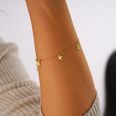 "Elevate your style with our exquisite 14K Solid Gold Dove Bracelet, a delicate piece that embodies the grace and beauty of nature. This Dainty Flying Bird Bracelet features five charming doves in flight, suspended on a dainty chain.  It's not just a piece of jewelry; it's a symbol of peace, freedom, and the beauty of life itself. Our 14K Solid Gold Dove Bracelet makes for a memorable and meaningful gift, symbolizing hope and love. It's the perfect choice for spreading joy and positivity during the holiday season. PRODUCT DETAILS:  * Material: 14K Solid Gold (real solid gold, no gold-filled or no gold plated material)  * Choice of Gold Color: Yellow Gold, Rose Gold, White Gold  * Bracelet Length: 7 inches (extension chain 0.6 inches) (If you need more, please contact us)  * Adjustable gold Location Names, Dove Bracelet, Bird Bracelet, Bracelet Minimal, Peace Bracelet, Locket Design, Dove Necklace, Minimal Bracelet, Dainty Gold Bracelet