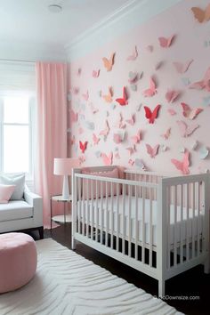 a baby's room decorated in pink and white, with butterflies on the wall