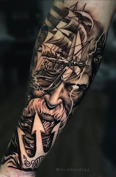 a man's arm with a ship on it