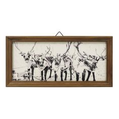 a framed painting with three deers on it's back and one standing in the middle