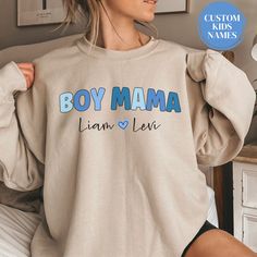 Personalized Boy Mama Sweatshirt With Kids Names Custom Mama Sweater Mothers Day Gift Mama Birthday Gift Momma Sweatshirt Custom Mom Crewneck Boy Mama Shirt Gift for Mama Gift Postpartum Gift Expecting Mom Gift The perfect vintage cozy sweatshirt for a stylish Boy Mama! This Personalized Boy Mama Sweatshirt With Kids Names makes the perfect Gift for Mama Birthday Gift or Mothers Day Gift for Mama. It's made from a soft, midweight cotton-blend fabric for easy layering when it gets chilly or throw it on alone for comfort. Full of style and comfort, we think this sweatshirt has all the qualities cool Mama could ever want. Runs true to size, but size up if you'd like a more oversized fit. *Please note - At this time, we are not able to offer gift messaging, wrapping or notes, please send a sep Graphic Print Sweatshirt For Birthday And Mother's Day, Long Sleeve T-shirt With Letter Print For Gender Reveal, Mother's Day Birthday Graphic Print Sweatshirt, Cotton Letter Print Sweatshirt For Gender Reveal, Casual Letter Print Sweatshirt For Gender Reveal, Personalized Crew Neck Sweatshirt For Birthday, Mother's Day Birthday Crew Neck Sweatshirt, Lettering Crew Neck Sweatshirt For Birthday, Long Sleeve T-shirt For Birthday And Mother's Day