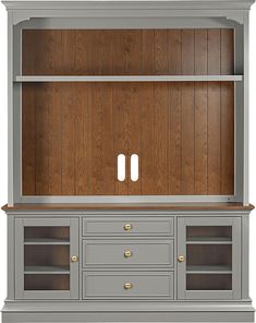 a large gray entertainment center with two doors and drawers on each side, in front of a wood paneled wall