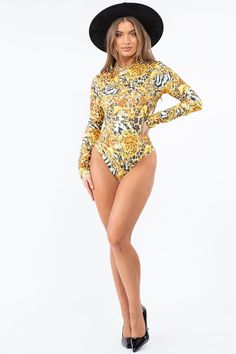 Description: Print bodysuit with long sleeves and mock neck, super Stretch Fabric Stretch bodysuit Long sleeve 95% polyester 5% spandex Hand wash cold Model is wearing a small Please see size chart for information on the fit Cheap Yellow Playwear Bodysuit, Cute Cartoon Print Bodysuit, Affordable Yellow Party Bodysuit, Fishnet Bodysuit, Casual Beach Wear, Yellow Print, Print Bodysuit, Shop Swimwear, New Arrival Dress