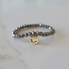 Add some bling to your wrist with our Personalized Crystal Stacks! You can personalize your stack bracelet with a name, date, initials, or a word of choice on a simple, classic disc charm. With neutral colors and faceted beads that shine and shimmer in the light, you can be reminded of a motivating word, memory, or special loved one whenever you look down at your wrist! A perfect gift for the everyday stack wearing lover! *Elastic stack bracelets are made with 6mm faceted crystals *Personalized Everyday Stackable Round Name Bracelet, Adjustable Nickel-free Name Bracelet For Everyday, Everyday Silver Stackable Name Bracelet, Silver Stackable Name Bracelet For Everyday, Personalized Silver Beaded Bracelets For Everyday, Customizable Silver Stretch Bracelet, Adjustable Silver Stretch Bracelet Customizable, Adjustable Round Name Bracelet For Everyday, Silver Spiritual Stretch Bracelet For Everyday