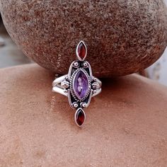 HELLO BUYERS  WELCOME MY SHOP ! ✦ Visit our Etsy shop : https://www.etsy.com/in-en/shop/poojasilvershine?ref=seller-platform-mcnav and check out all our styles in Jewelry :) Amethyst and Garnet ring, Boho amethyst ring, Sterling Silver Ring, Bridesmaid Rings, natural gemstone ring, designer ring, Gift for mother 》D E T A I L S《 GEMSTONE DETAILS : ✦ Gemstone: Natural amethyst and garnet  ✦ Gemstone Type: Natural ✦ Gemstone Shape: marquise (leaf) ✦ Gemstone Color: purple and red ✦ Gemstone Type: C Gift Marquise Amethyst Ring, Marquise Amethyst Ring Gemstone Gift, Marquise Amethyst Ring Gift, Marquise Amethyst Ring As Gift, Bohemian Multi-stone Rings For Gifts, Marquise Amethyst Ring With Accent Stones For Gift, Purple Rings With Stones For Gift, Purple Rings With Stones As Gift, Bohemian Multi-stone Wedding Rings