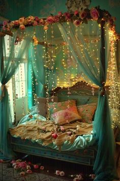 a canopy bed decorated with lights and flowers