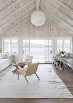 a living room filled with furniture and white walls