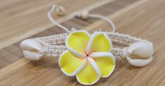 "Handmade Plumeria Flower Hemp Bracelet. Also available in a variety of colors to choose from. 🌿Natural Color Hemp Cord -with 3 Hawaiian Plumeria Flower Charms 🌸Plumeria Flower Meaning: In Hawaiian culture, the plumeria symbolizes Positivity & New Life and is used to celebrate special occasions. 💕Fits Most Size- Pull the knots to adjust to you wrist. Adjustable from 5\" Inches up to 10\" Inches Around Wrist of Anklet. Wear this beautiful design as a bracelet or anklet. 💫Handmade - Hawaii Handmade Flower Bracelets For Beach, Handmade Flower Bracelet For Beach, White Flower Bracelets For Vacation, White Flower Friendship Bracelets For Beach, Yellow Flower Bracelets For The Beach, Yellow Flower Bracelets For Beach, Yellow Flower Bracelet For The Beach, Handmade Flower Friendship Bracelets In Yellow, Handmade Yellow Flower Friendship Bracelets