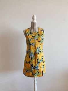 "This is a beautiful floral above the knee dress in bright yellow color with large floral print.  This vintage 60s style shift dress fits like size S. This mod style sleeveless dress is perfect to wear when you want to spice up your looks with a color splash. Perfect flower power mini dress for any occasion. This gorgeous zip up dress is double sided - if you flip it around - it's bright orange color. Smartly made versatile piece of clothing.  Era: 90s Brand: Bavaria Condition: great vintage con Retro Sleeveless Beach Dress, Mod Sleeveless Lined Dress, Vintage Sleeveless Lined Mini Dress, Sleeveless Vintage Dress With Retro Print, Retro Sleeveless Lined Dress, Sleeveless Retro Mini Dress With Retro Print, Vintage Mini Dress For Vacation, Retro Mini Dress For Vacation, Vintage Sleeveless Mini Dress With Floral Print