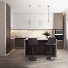 two bar stools sit in front of a kitchen island